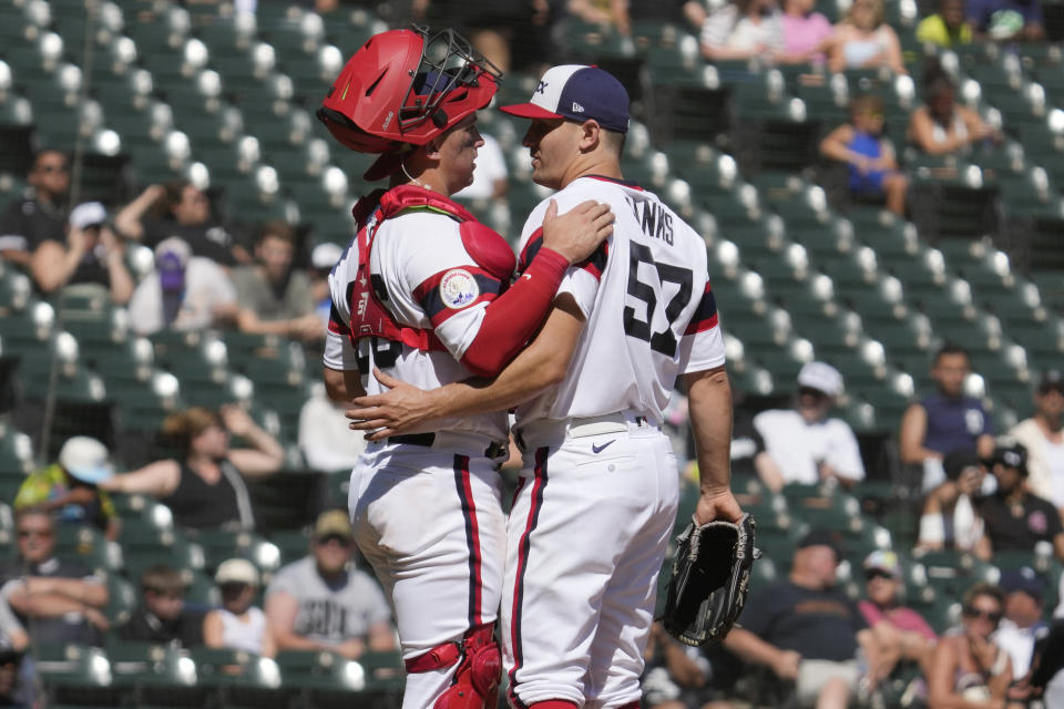 Chicago White Sox catcher Korey Lee, left, talks with relief pitcher Tanner Banks during the fifth inning of a baseball game against the Detroit Tigers in Chicago, Sunday, Sept. 3, 2023. (AP Photo/Nam Y. Huh)