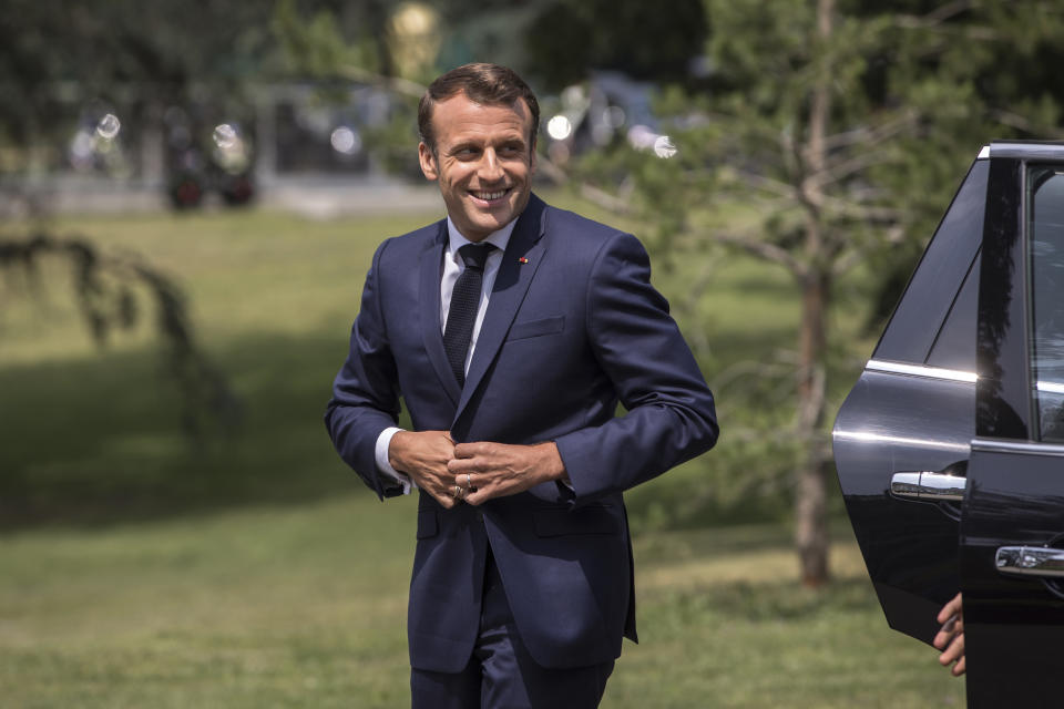 French President Emmanuel Macron arrives to meet French National Women's Soccer team during a visit at France's training camp in Clairefontaine, south of Paris, France, Tuesday, June 4 2019. The French women soccer team is preparing for the FIFA Women's World Cup that will start in France next Friday. (Christophe Petit Tesson, Pool via AP)