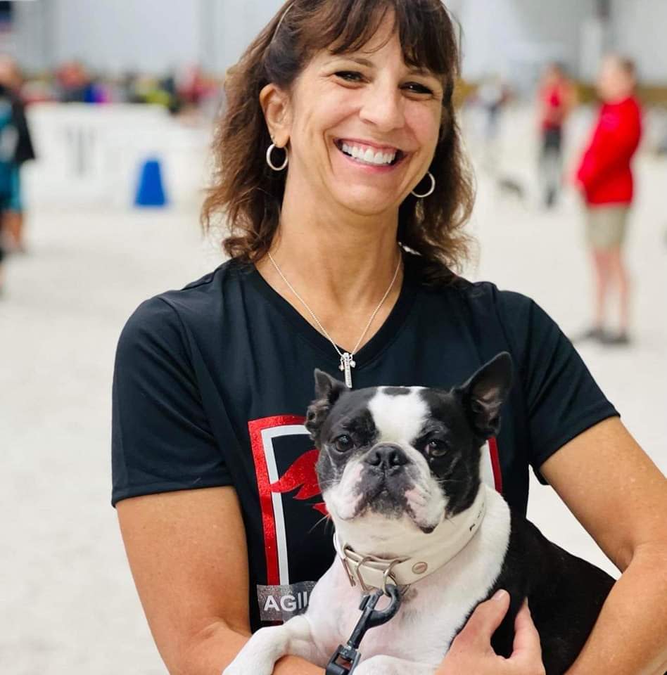 Spiffy, a seven-year-old Boston Terrier pictured with his owner, Stacy Price.
