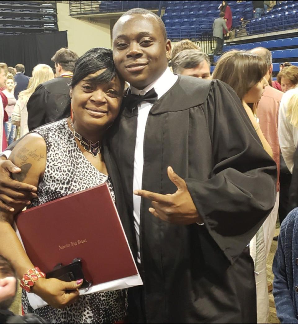 Keith Mosely poses with his mom, Teresa Mosely, at his graduation from Asheville High School.