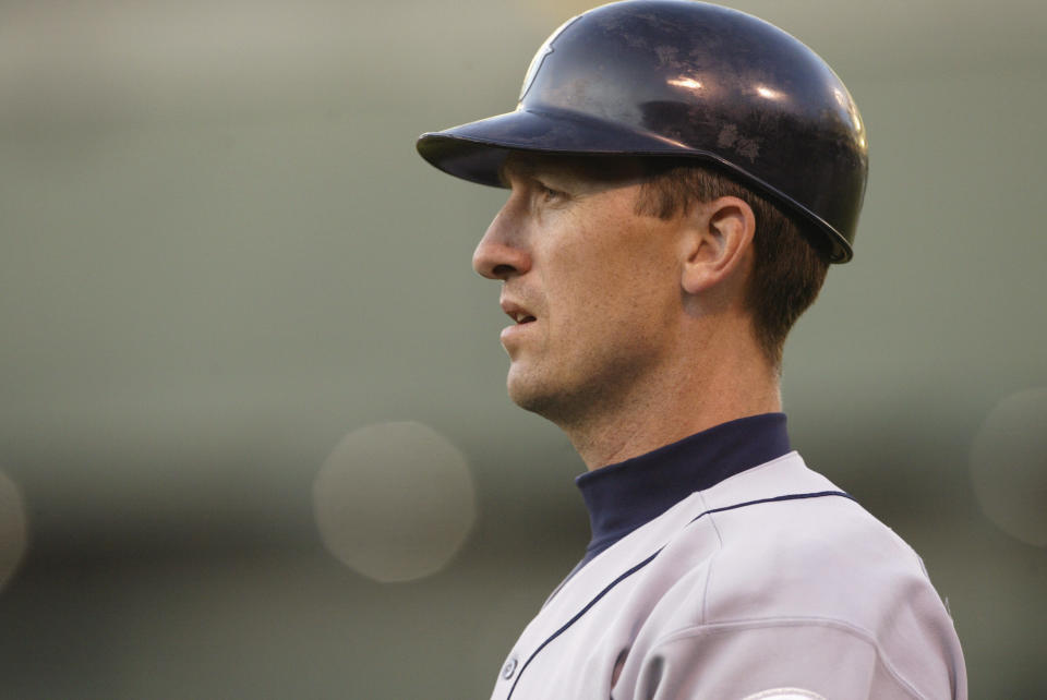 OAKLAND, CA - APRIL 9:  John Olerud #5 of the Seattle Mariners looks on during the game against the Oakland A's on April 9, 2004 at Network Associates Coliseum in Oakland, California.  The A's won 8-6.  (Photo by Stephen Dunn/Getty Images)