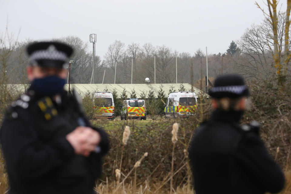 Vehicles from the Metropolitan Police parked near to Great Chart Golf and Leisure. (PA)