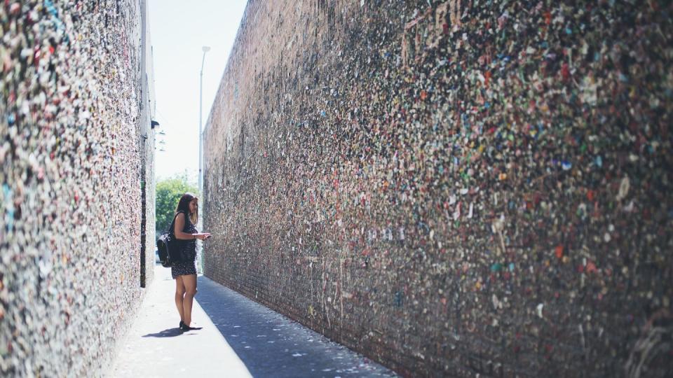 young woman standing in bubblegum alley