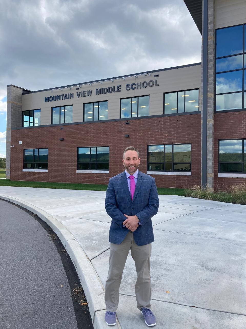 Former teacher Jake Miller stands outside Mountain View Middle School.