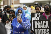 People gather for a peaceful demonstration, Thursday, April 22, 2021, in Elizabeth City, N.C., protesting the shooting of Andrew Brown Jr., 42, by a deputy sheriff trying to serve a search warrant. (AP Photo/Gerry Broome)