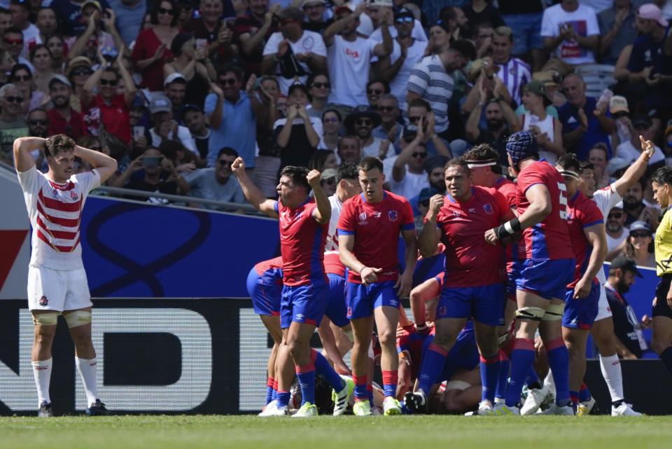 Chile players celebrate after scoring a try during the Rugby World Cup Pool D match between Japan and Chile at Stadium de Toulouse, Toulouse, France, Sunday, Sept. 10, 2023. (AP Photo/Lewis Joly)