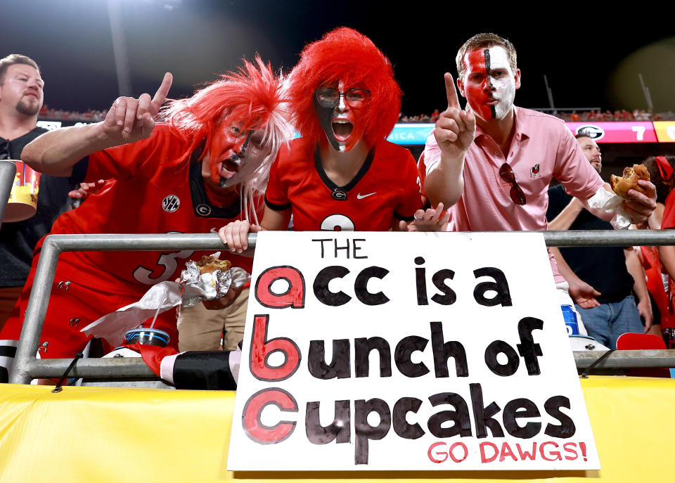 CHARLOTTE, NORTH CAROLINA - SEPTEMBER 04: Georgia Bulldogs fans cheer on their team against the Clemson Tigers during the second half of the Duke's Mayo Classic at Bank of America Stadium on September 04, 2021 in Charlotte, North Carolina. (Photo by Grant Halverson/Getty Images)