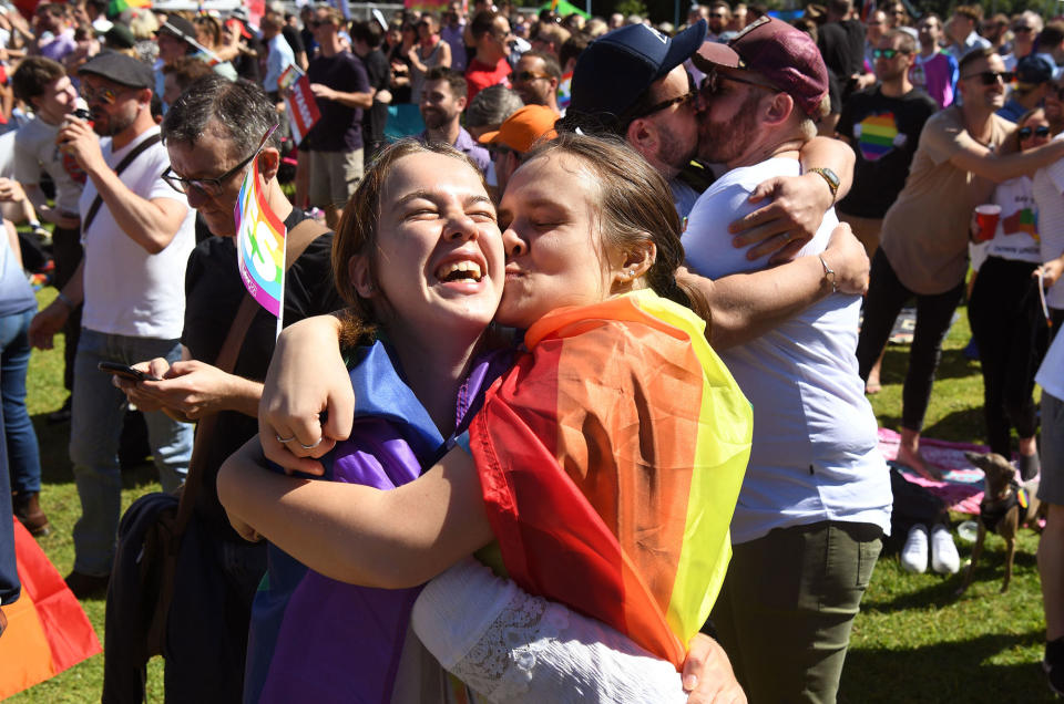 <p>Supporters of the same-sex marriage ‘Yes’ vote gather to celebrate the announcement in a Sydney park on Nov. 15, 2017. (Photo: William West/AFP/Getty Images) </p>