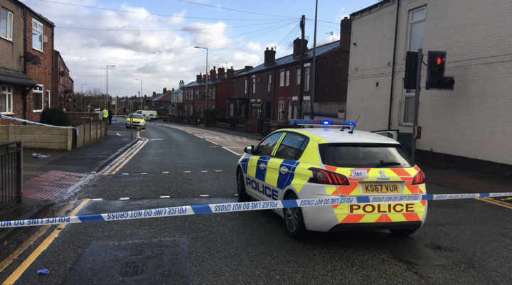 Police closed down Atherton Road, in Greater Manchester, after two women were stabbed (Picture: Yunus Mulla/BBC North West Tonight)