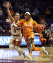 Jordan Walker (4) of Tennessee drives while defended by Virginia Tech's Georgia Amoore (5) in the first half of an NCAA college women's basketball game in Blacksburg Va., Sunday, Dec. 5, 2021. (Matt Gentry/The Roanoke Times via AP)