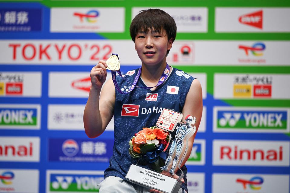 Gold medallist Akane Yamaguchi of Japan poses on the podium with her medal and trophy after her victory over Chen Yufei of China in their women's singles final match at the World Badminton Championships in Tokyo on August 28, 2022. (Photo by Philip FONG / AFP) (Photo by PHILIP FONG/AFP via Getty Images)