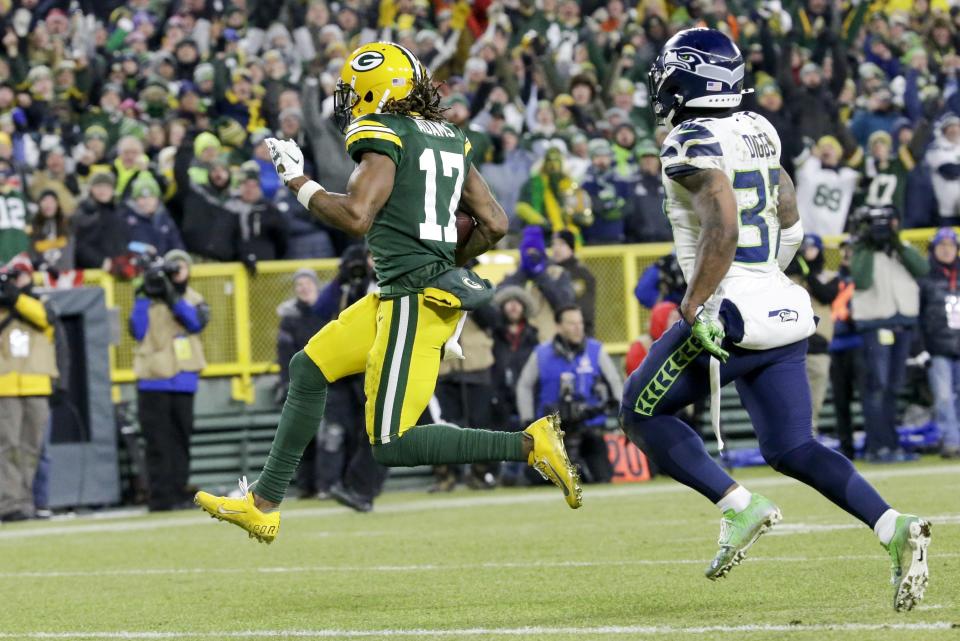 Green Bay Packers' Davante Adams runs to the endzone for his touchdown catch during the second half of an NFL divisional playoff football game against the Seattle Seahawks Sunday, Jan. 12, 2020, in Green Bay, Wis. (AP Photo/Mike Roemer)