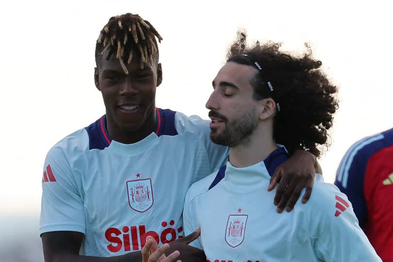 Spain's midfielder #17 Nico Williams (2L), Spain's defender #24 Marc Cucurella (C) attend a training session