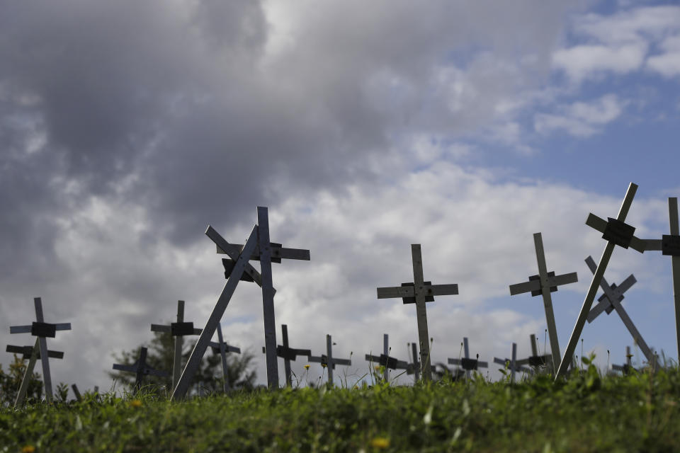 Crosses bearing tags with names are seen in a graveyard of the Flaminio Cemetery, in Rome, Friday, Oct. 16, 2020. Italian prosecutors and the government’s privacy watchdog are investigating how the names of women who miscarried or had abortions ended up on crosses over graves for the fetuses in a Rome cemetery. (AP Photo/Gregorio Borgia)