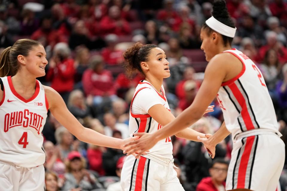 Jan 11, 2024; Columbus, Ohio, USA; Ohio State Buckeyes guard Jacy Sheldon (4), guard Celeste Taylor (12) and guard Taylor Thierry (2) high five during the first half of the NCAA women’s basketball game against the Rutgers Scarlet Knights at Value City Arena.