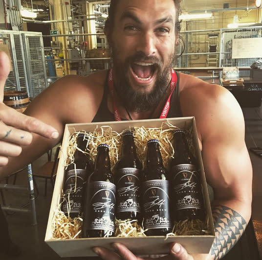 Jason Momoa smiles while seeing his own Guinness for the first time in 2016