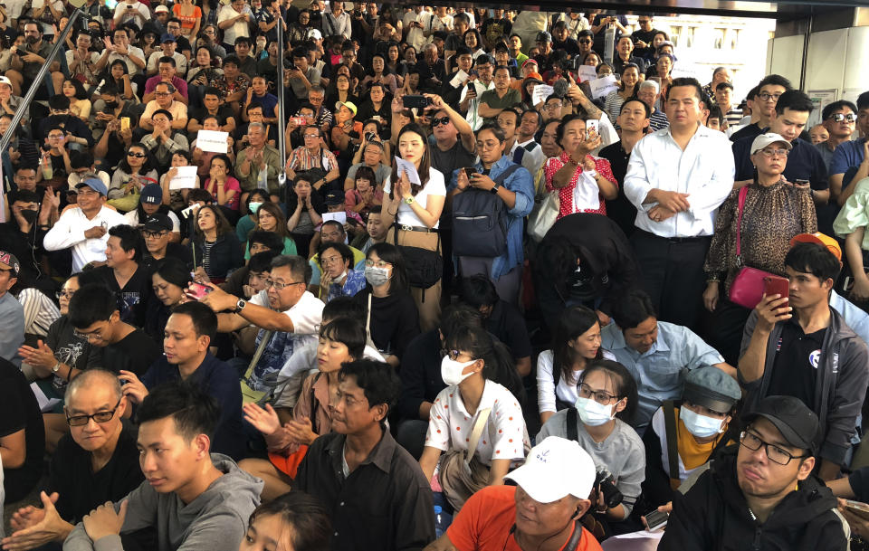 Thailand's Future Forward Party leader Thanathorn Juangroongruangkit talks to his supporters during rally in Bangkok, Thailand, Saturday, Dec. 14, 2019. Several thousand supporters of a popular Thai political party, under threat of dissolution, packed a concourse in central Bangkok on Saturday in one of the largest political demonstrations in recent years.(AP Photo/Jerry Harmer)