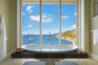 <p>As if a Caribbean retreat wasn't luxury enough, this one is also based on the billionaire Virgin founder Sir Richard Branson's private estate of Necker Island. The penthouse features a tub with views of the Oil Nut Bay waters and breathtaking cliffs.</p>