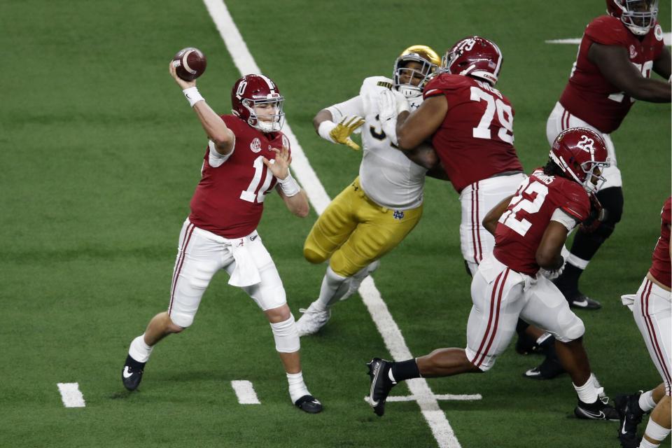 Alabama QB Mac Jones (10) throws a pass under pressure from the rush by Notre Dame in the second half of the Rose Bowl on Jan. 1. (AP)