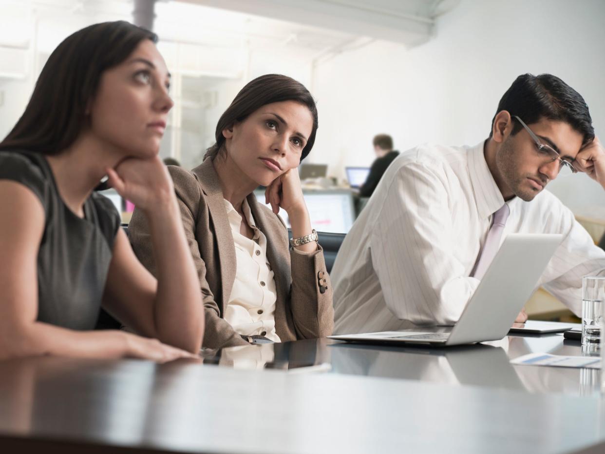 Business people sitting in meeting - stock photo