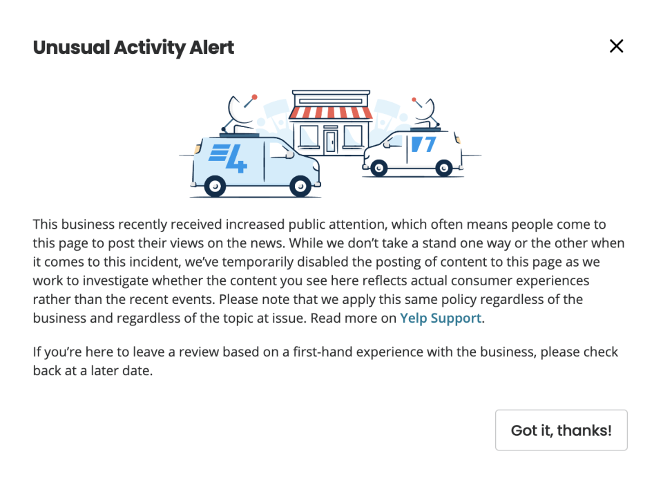 Pop-up alert on Yelp indicating a temporary pause on content posting due to unusual activity