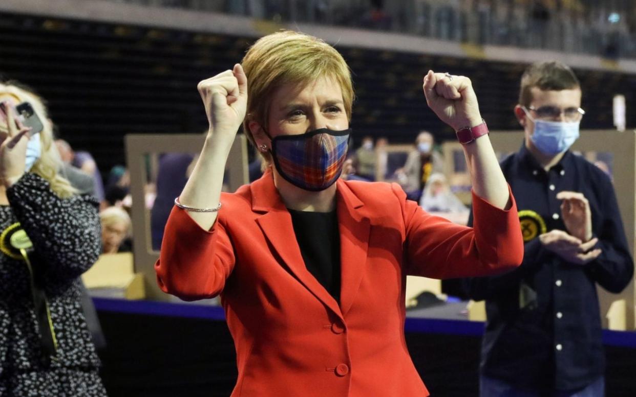 Scottish First Minister Nicola Sturgeon reacts as she visits a counting centre as votes are counted for the Scottish Parliamentary election, in Glasgow, Scotland, Britain, May 7, 2021.  - Russell Cheyne/REUTERS