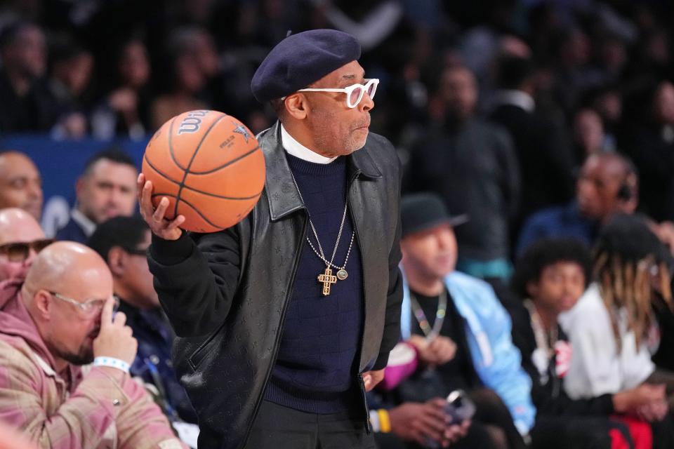 Spike Lee throws a basketball during the first half of the NBA All Star Game at Gainbridge Fieldhouse.