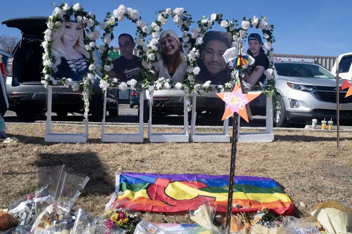 Photos of the victims killed in the Club Q shooting are placed along a memorial in Colorado Springs on Nov. 22, 2022.