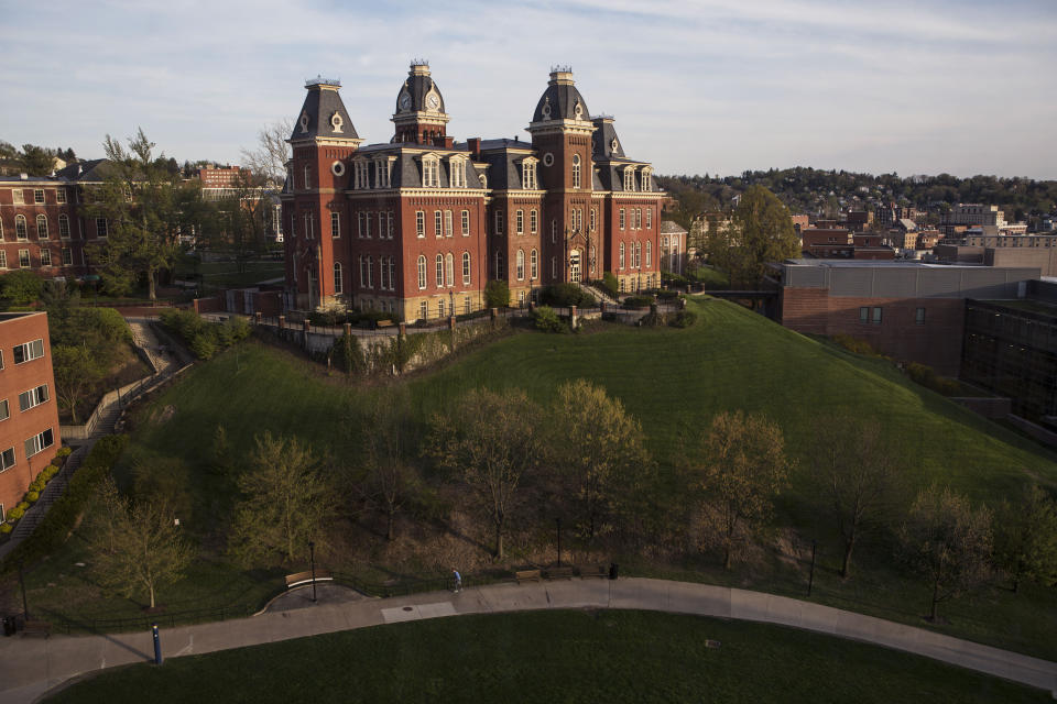 FILE - Woodburn Hall on West Virginia University downtown campus is shown April, 24, 2015, in Morgantown, W.Va. West Virginia University on Friday, Aug. 11, 2023, recommended the elimination of 9% of the majors offered on its Morgantown campus along with a wide-ranging reduction in faculty to address a $45 million budget shortfall. (AP Photo/Raymond Thompson, File)