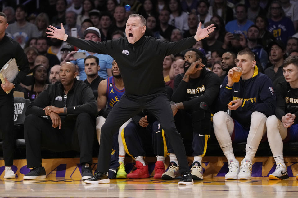 Denver Nuggets head coach Michael Malone argues a call in the second half of Game 3 of the NBA basketball Western Conference Final series Los Angeles Lakers Saturday, May 20, 2023, in Los Angeles. (AP Photo/Mark J. Terrill)