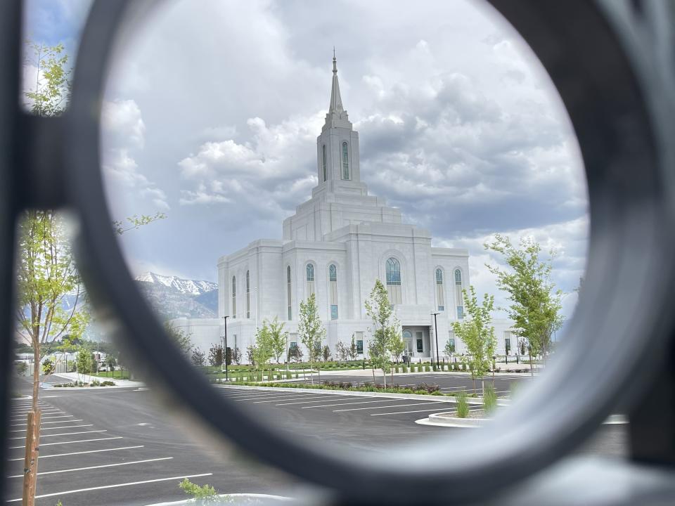 The new Orem Utah Temple is seen through a fence on the property on June 7, 2023.