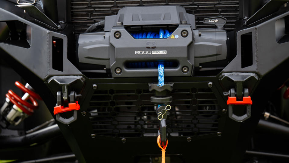 A close-up of the HD winch setup on a 2024 Polaris Xpedition side-by-side.