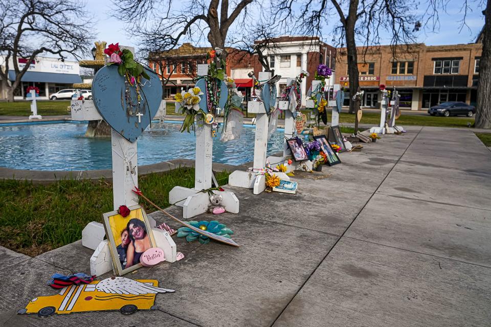 Crosses in the Uvalde Town Square honor the 21 victims of the May 24, 2022, mass shooting at Robb Elementary School. Some of the victims' families are now suing Instagram, a video game company and a gun manufacturer.