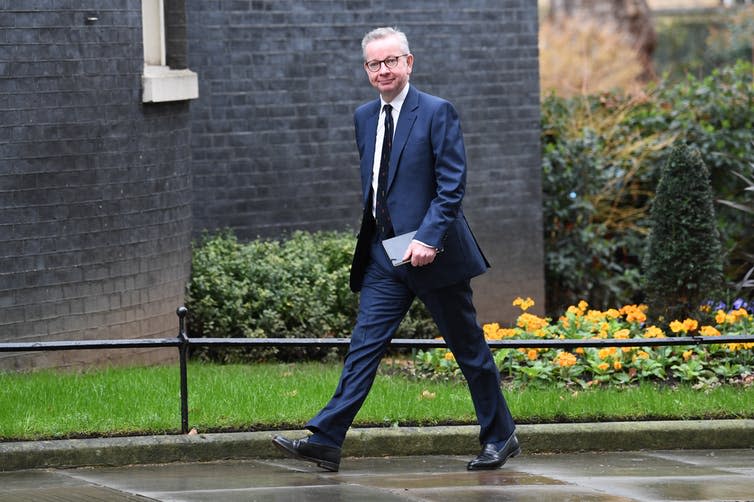 <span class="caption">A smiling Michael Gove arrives at Downing Street to discover his fate.</span> <span class="attribution"><a class="link " href="https://www.paimages.co.uk/search-results/fluid/?q=cabinet%20reshuffle&amber_border=0&category=A,S,E&fields_0=all&fields_1=all&green_border=1&imagesonly=1&orientation=both&red_border=0&text=cabinet%20reshuffle&words_0=all&words_1=all" rel="nofollow noopener" target="_blank" data-ylk="slk:Stefan Rousseau/PA Wire/PA Images;elm:context_link;itc:0;sec:content-canvas">Stefan Rousseau/PA Wire/PA Images</a></span>