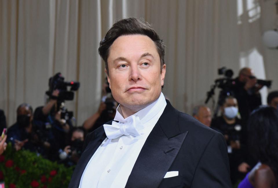 In this file photo taken on May 02, 2022, Elon Musk arrives for the 2022 Met Gala at the Metropolitan Museum of Art in New York. - Elon Musk on May 10, 2022, said he would lift Twitter's ban on former US president Donald Trump if Musk's deal to buy the global messaging platform is successful. "I would reverse the ban," the billionaire said at a Financial Times conference, noting that he doesn't own Twitter yet, so "this is not like a thing that will definitely happen." (Photo by Angela Weiss / AFP) (Photo by ANGELA WEISS/AFP via Getty Images)