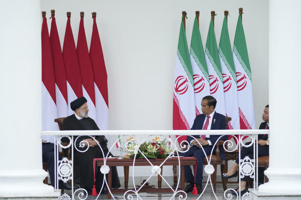 Iran's President Ebrahim Raisi, left, talks to Indonesian President Joko Widodo during their meeting at the Presidential Palace in Bogor, West Java, Indonesia, Tuesday, May 23, 2023.(AP Photo/Achmad Ibrahim)