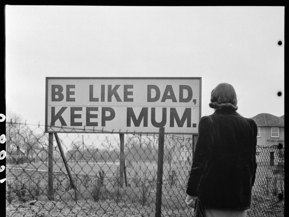 Propaganda sign encouraging people not to talk freely during wartime in the 1940s. The slogan uses a play on words: keeping mum means to be silent. The government was concerned that enemy spies might pick up useful information by listening to careless conversations.