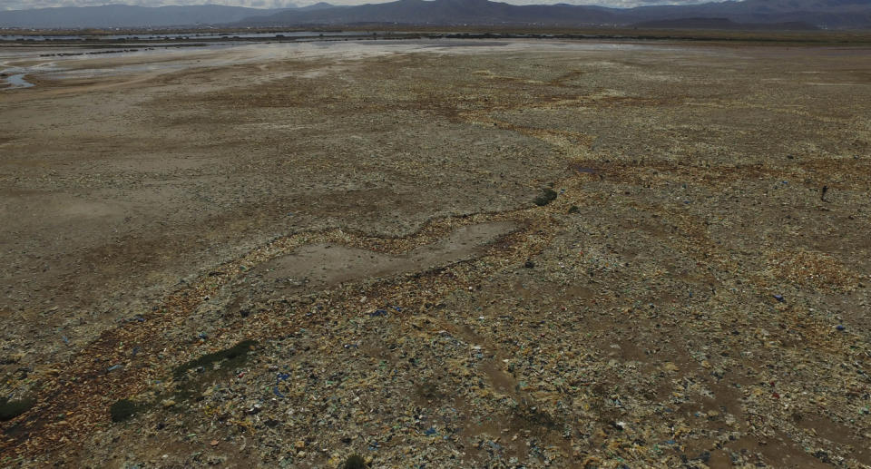 Plastic bottles and other garbage cover a dried-up part of Uru Uru Lake near Oruro, Bolivia, Thursday, March 25, 2021. (AP Photo/Juan Karita)