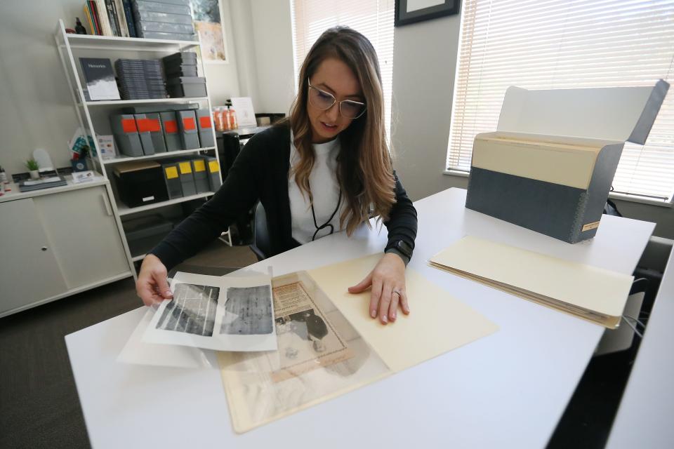 Brooke Lake, archivist and founder of Monocurate, sorts through the a family collection.