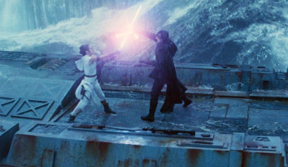 Daisy Ridley and Adam Driver in a lightsaber battle in Star Wars