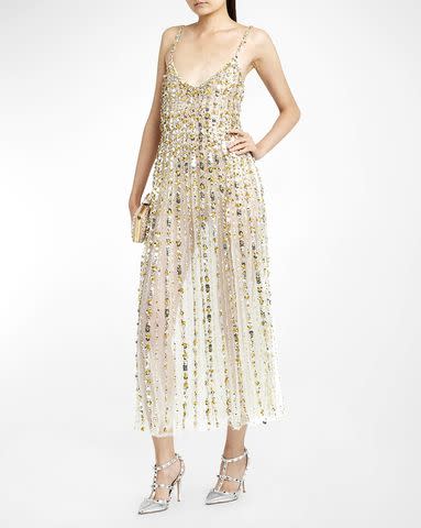 <p>Neiman Marcus</p> Valentino's sequin embroidered sheer cocktail dress in the color silver muli from their from their resort 2024 collection