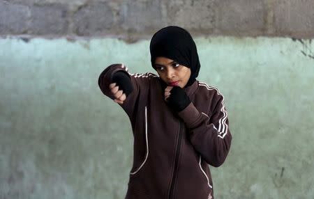 Misbah, 17, takes part in warm up exercises at the first women's boxing coaching camp in Karachi, Pakistan February 19, 2016. REUTERS/Akhtar Soomro