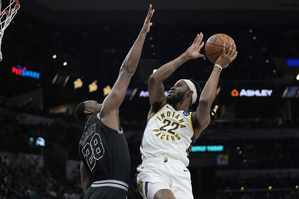 Indiana Pacers forward Isaiah Jackson (22) drives to the basket against San Antonio Spurs center Charles Bassey (28) during the first half of an NBA basketball game in San Antonio, Thursday, March 2, 2023. (AP Photo/Eric Gay)