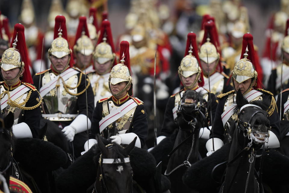 The Royal House Cavalry returns to Buckingham Palace after the State Opening of Parliament at the Palace of Westminster in London, Tuesday, May 10, 2022. Queen Elizabeth II did not attend amid ongoing mobility issues. (AP Photo/Frank Augstein)