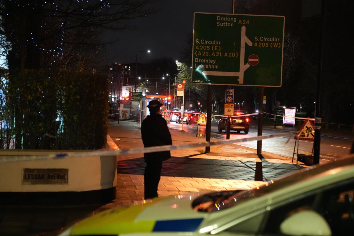 Police at the scene in Lessar Avenue near Clapham Common, south London, where a woman and her two young children have been taken to hospital after a man threw a suspected corrosive substance on Wednesday evening. Three other members of the public were also taken to hospital with injuries thought to have been suffered as they came to the aid of the woman and her children. Picture date: Thursday February 1, 2024.