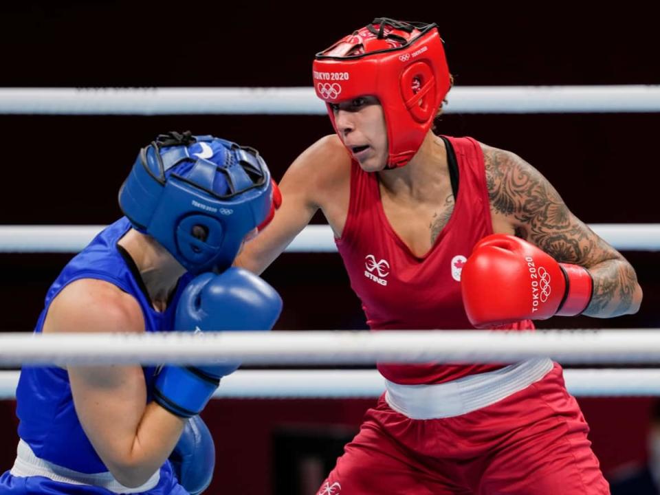 Canada's Tammara Thibeault, right, fights Netherlands' Nouchka Fontijn during their women's middleweight 75-kg boxing match at the 2020 Summer Olympics in Tokyo, Japan.  (Themba Hadebe/The Associated Press - image credit)