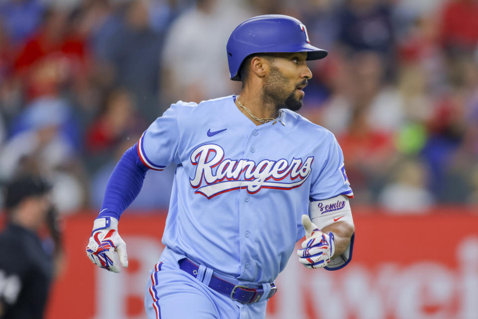 Texas Rangers' Marcus Semien jogs the bases after hitting a lead off home run during the first inning of a baseball game against the Cleveland Guardians, Sunday, July 16, 2023, in Arlington, Texas. (AP Photo/Gareth Patterson)