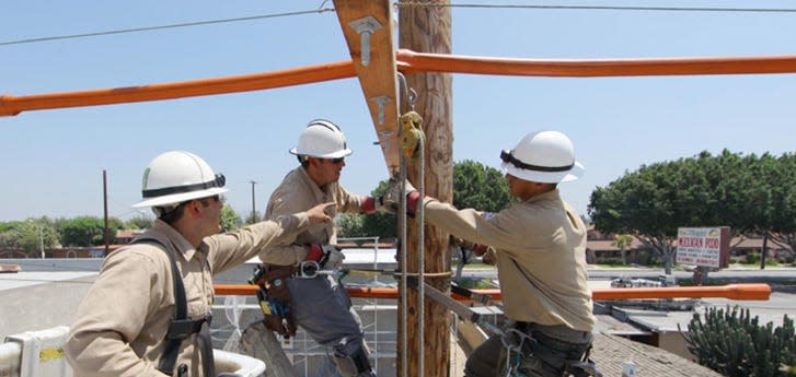 Southern California Edison workers repairing a power line