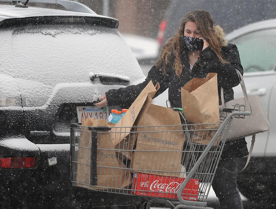 As the snow began to fall, McKenzie Sparling, of Marlborough,  stocked up on groceries at the Framingham  Stop and Shop, Feb. 1, 2021.