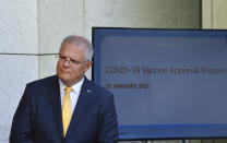 Australia's Prime Minister Scott Morrison speaks at a press conference at Parliament House in Canberra, Monday, Jan. 25, 2021. Australia's medical regulator has approved use of its first coronavirus vaccine, paving the way for inoculations to begin next month. (Mick Tsikas/AAP Image via AP)